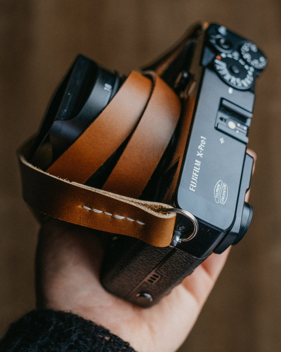 hand made leather camera strap in English tan Horween Chromexcel leather