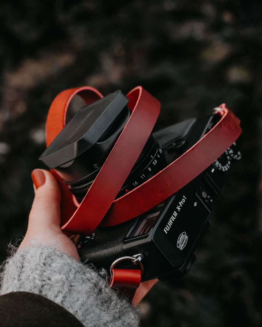 red leather camera strap