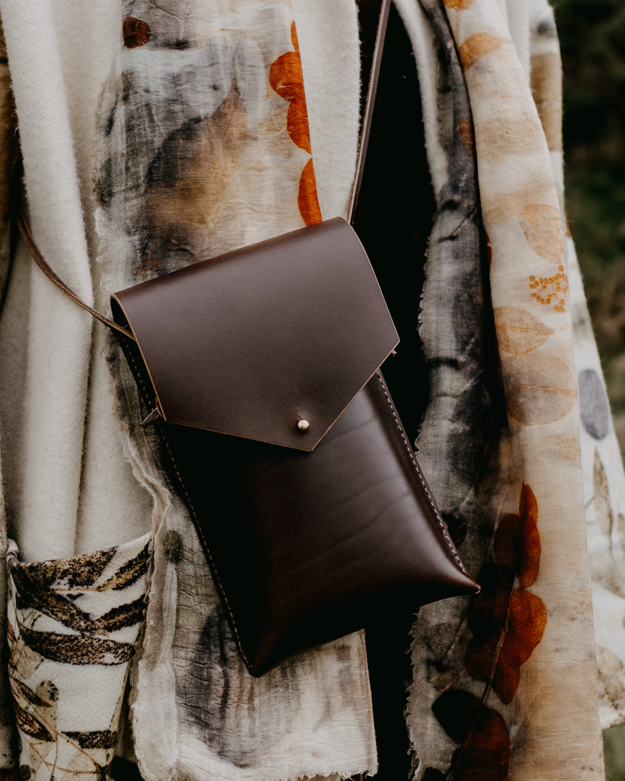 brown leather phone bag with adjustable strap