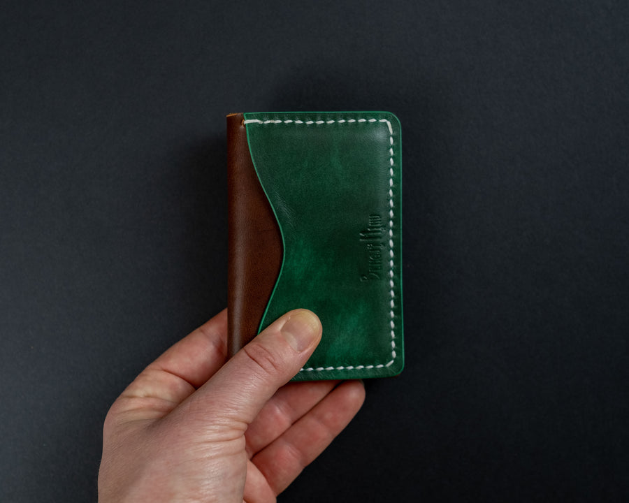 green and brown leather wallet