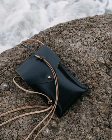 black leather bag with long strap